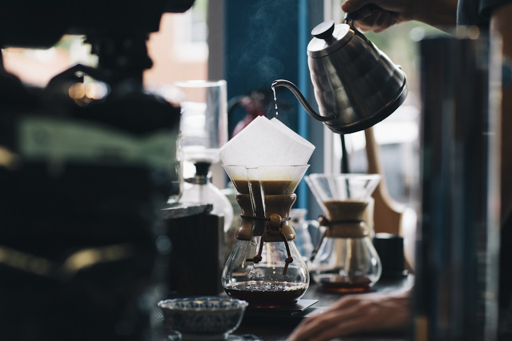 Pour-over coffee preparation at a cafe counter